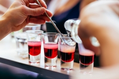 Bartender pouring shots cocktails